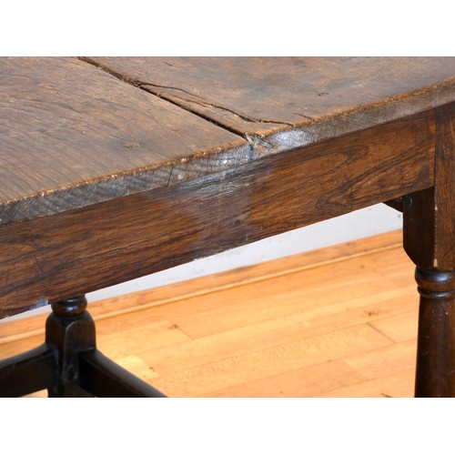 402 - An early 18th century lowboy, the two plank moulded top over a single frieze drawer with brass drop ... 