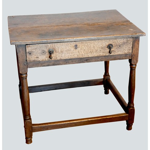 402 - An early 18th century lowboy, the two plank moulded top over a single frieze drawer with brass drop ... 