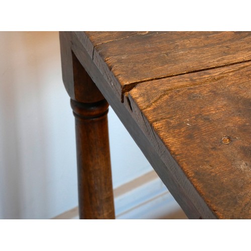 402 - An early 18th century lowboy, the two plank moulded top over a single frieze drawer with brass drop ... 