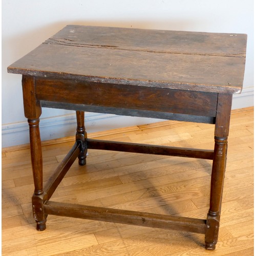 402 - An early 18th century lowboy, the two plank moulded top over a single frieze drawer with brass drop ... 