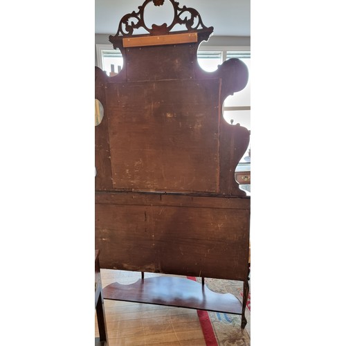 378 - A Victorian mahogany ornate display cabinet, the shaped raised back set with a bevelled oval mirror ... 