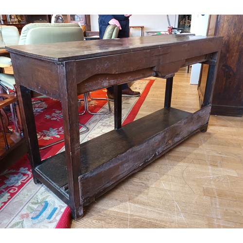 396 - A Georgian oak dresser base, the projecting top fitted with two long drawers having brass loop handl... 