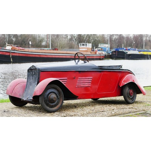 42 - Eureka Super Junior 35 child's pedal car, c.1935-38, metal body painted in red over black, metal dis... 