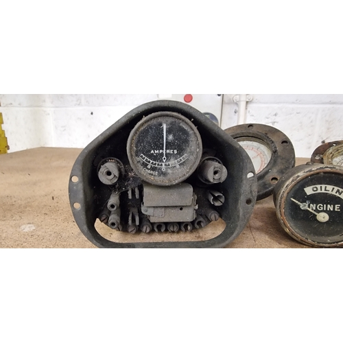 74 - Two Telegauge petrol gauges, an Engine Oiling gauge, a CAV voltmeter and ampere gauge and another am... 