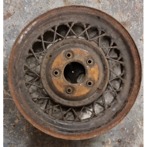 68 - Three vintage wire wheels, one with a 3 1/2