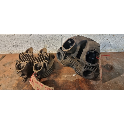 104 - A Norton Dominator cylinder head and a Triumph 500 pre unit head