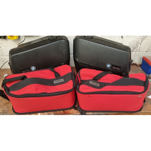 130 - A pair of BMW hard panniers and a pair of Oxford Sovereign soft panniers