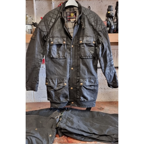 131 - A Belstaff wax jacket, size 44, together with a pair of Trail Master trousers, size 30 and two pairs... 