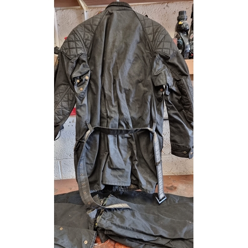 131 - A Belstaff wax jacket, size 44, together with a pair of Trail Master trousers, size 30 and two pairs... 