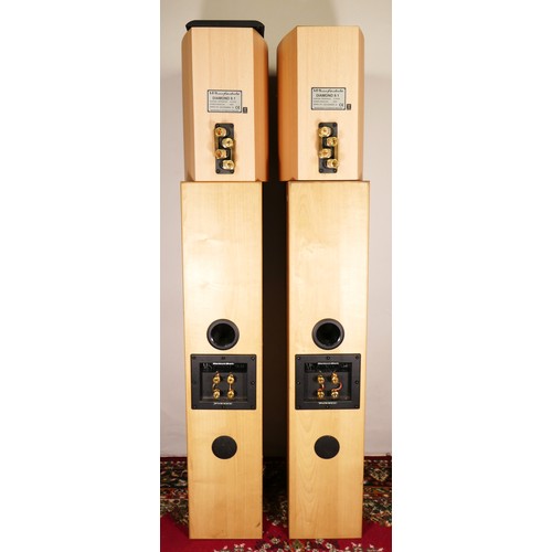 213 - A pair of Mordaunt Short floor standing speakers Avant 904, natural wood, together with a pair of Wh... 