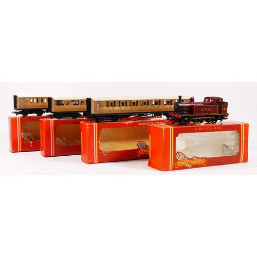 69 - A Hornby OO gauge loco, 16440, in maroon livery, boxed together with three Hornby coaches to include... 