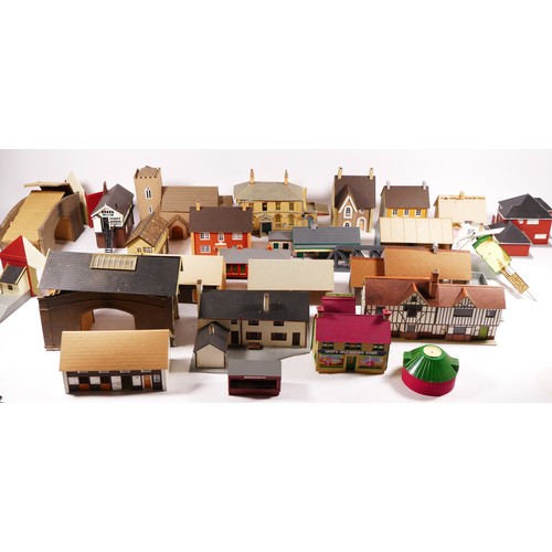 71 - A substantial collection of scratch built buildings for a model railway including signal boxes, hous... 