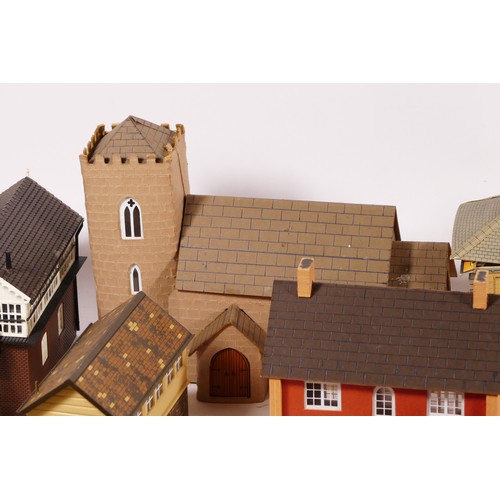 71 - A substantial collection of scratch built buildings for a model railway including signal boxes, hous... 