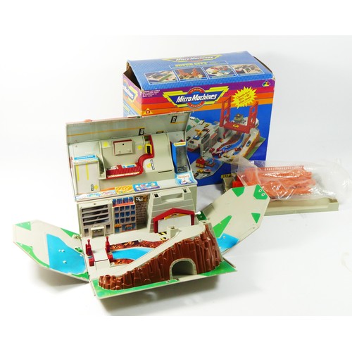 74 - A Micro Machines Super City Toolbox including bridge and airport runway, original box