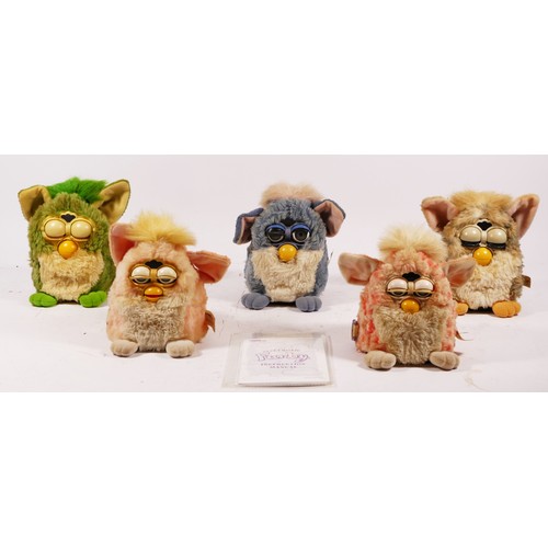 77 - Five Furby toys, made by Tiger, one with purple seal and two others, together with two Furby babies,... 