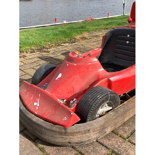 80 - A fairground ride vehicle in the form of a Formula 1 car, with hinged rear spoiler, opens to reveal ... 