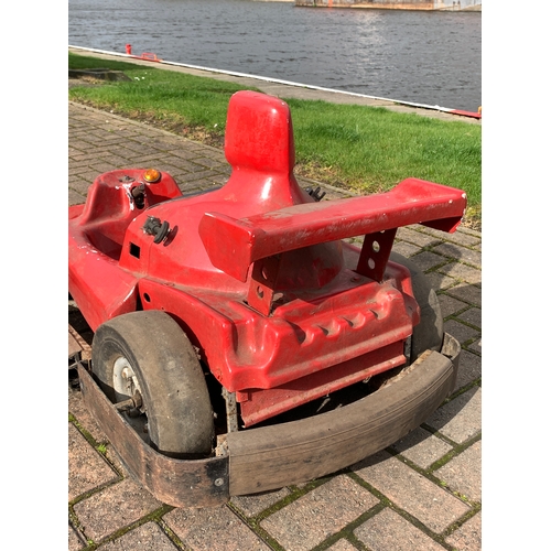 80 - A fairground ride vehicle in the form of a Formula 1 car, with hinged rear spoiler, opens to reveal ... 