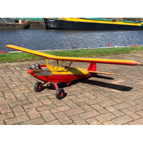 83 - A Radio Controlled model plane with a Super Tigre 60 engine, removable cockpit cover opens to reveal... 