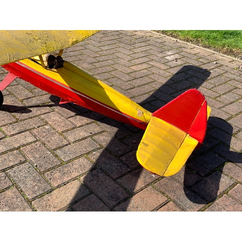 83 - A Radio Controlled model plane with a Super Tigre 60 engine, removable cockpit cover opens to reveal... 