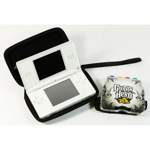 91 - A Nintendo DS Lite (serial No UEH15567329), with three styluses, carry case and Guitar Hero On Tour ... 