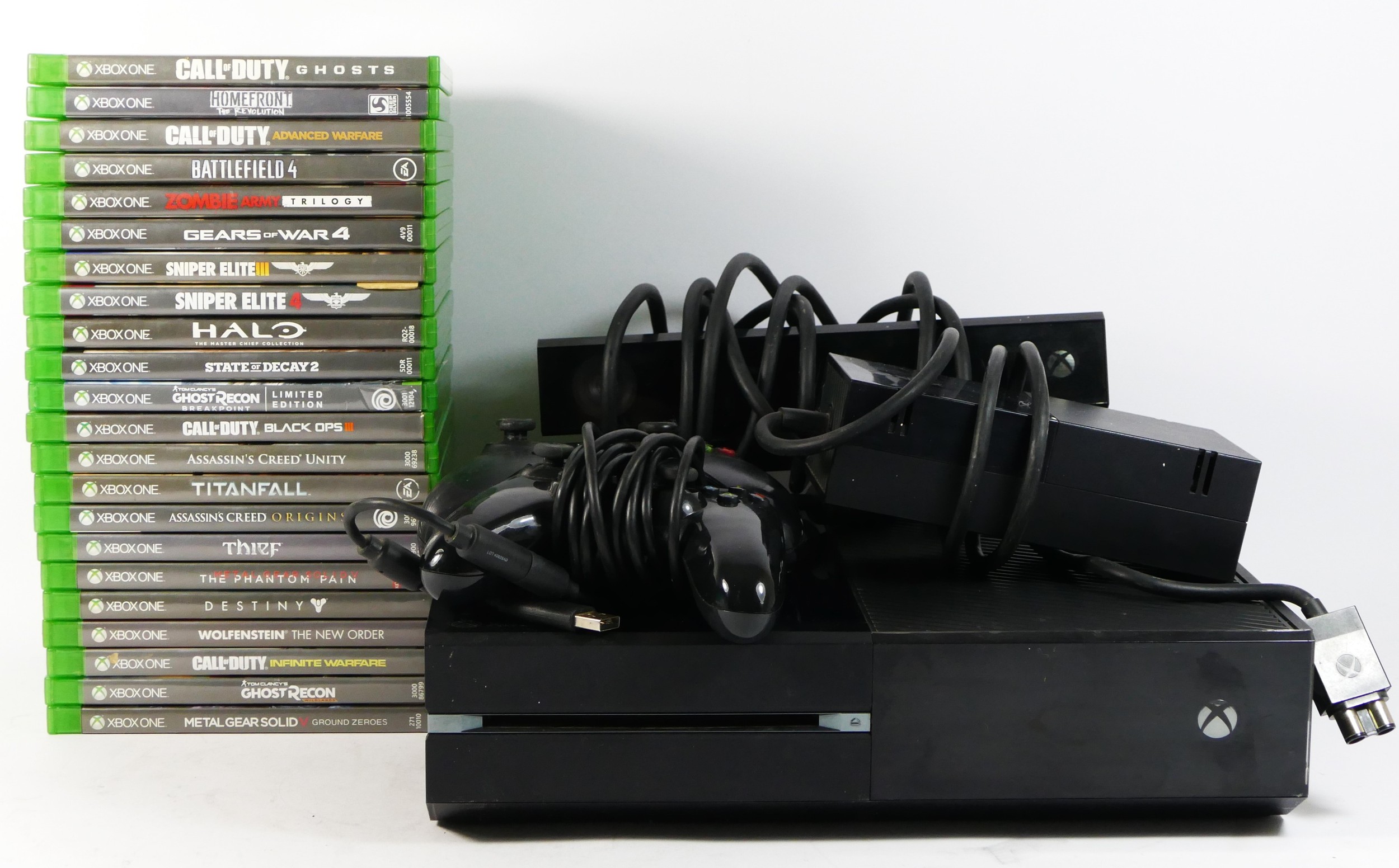 A Xbox One console, model 1540, with controller, power brick 