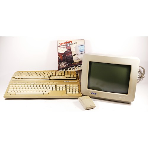 100 - A Atari 1040STe personal computer (serial No X2 213 011948), with Atari mouse (serial No X51C5541911... 