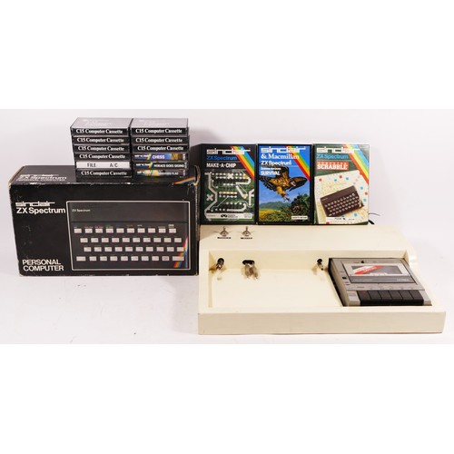 103 - A Sinclair ZX Spectrum (serial No001-514922) with manuals and brochures, original box, together with... 