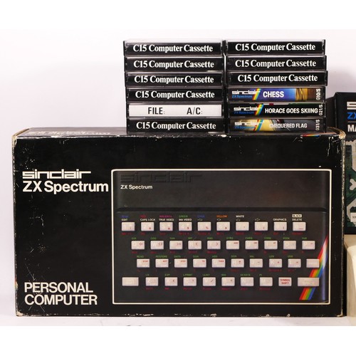 103 - A Sinclair ZX Spectrum (serial No001-514922) with manuals and brochures, original box, together with... 