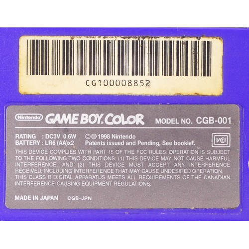 111 - A Nintendo Game Boy Color, in purple/grape colourway, model No CGB-001 (serial No CG100008852), toge... 