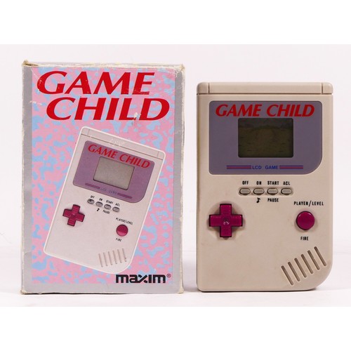 114 - A Maxim Game Child, handheld game, in original box

The Game Child was released to mimic the appeara... 