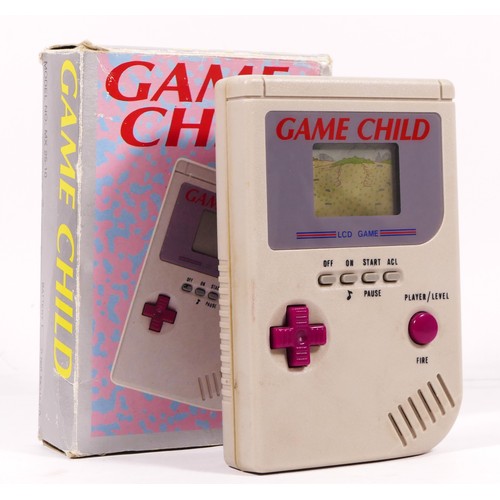 114 - A Maxim Game Child, handheld game, in original box

The Game Child was released to mimic the appeara... 