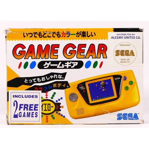 121 - A Sega Game Gear hand held console (serial No P61054129), Japanese limited edition, yellow, together... 