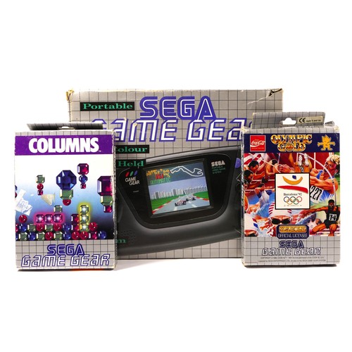 122 - A Sega Game Gear hand held console (serial No P313075561), in original box, together with two boxed ... 