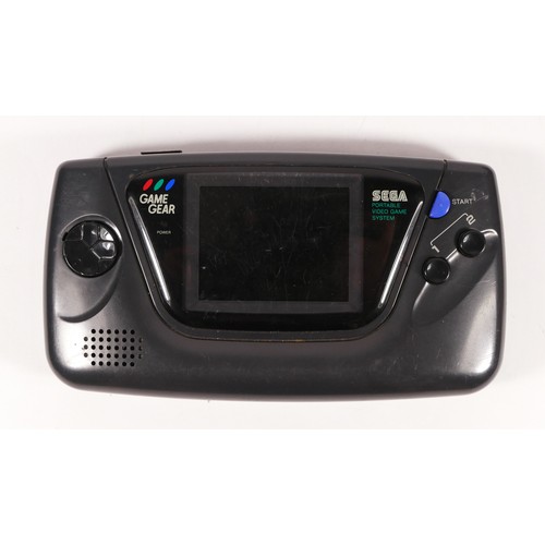 127 - A Sega Game Gear hand held console (serial No P31233126), for spares or repairs, together with a Mas... 