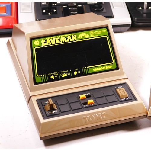 135 - Six electronic tabletop games, to include Caveman, by Tomy (two in gold, one in red), Astro Blaster,... 