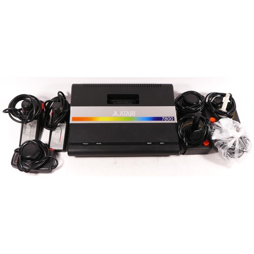 148 - A Atari 7800 console (serial No X9383802185), with power cable, two joysticks, two Atari driving con... 