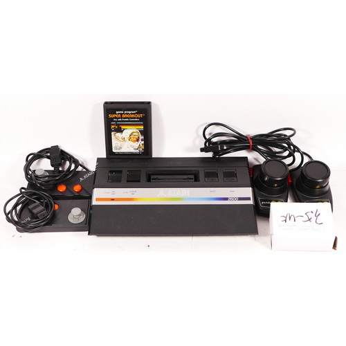 150 - A Atari 2600 console (serial No X1063969925), with power cable, two paddle controllers and two Atari... 