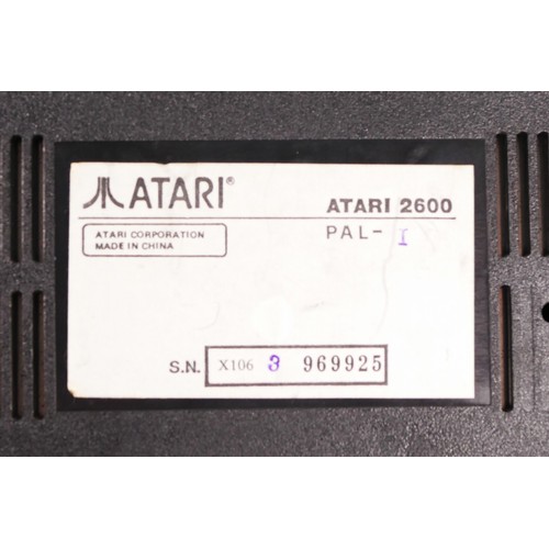 150 - A Atari 2600 console (serial No X1063969925), with power cable, two paddle controllers and two Atari... 