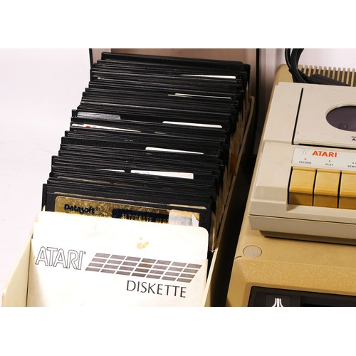 152 - A Atari 810 5 ¼ inch floppy disk drive, together with approximately one hundred floppy disk, to incl... 