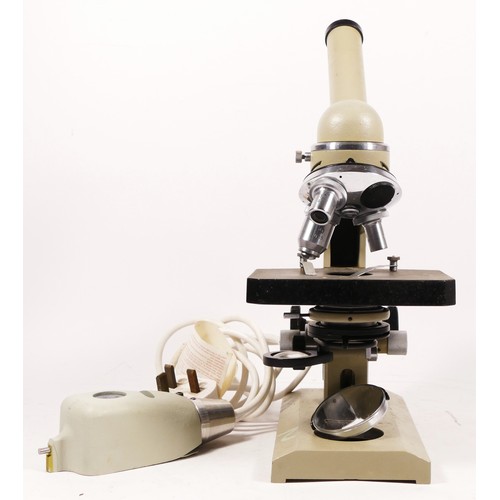 158 - A Nomo microscope, Russian made, with a K10x optic and a Model SL-5 microscope illuminator, together... 