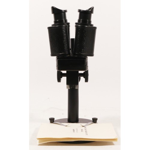 162 - A Binocular microscope, Russian made, stamped BM-5-2 (serial No 885681), together with manual