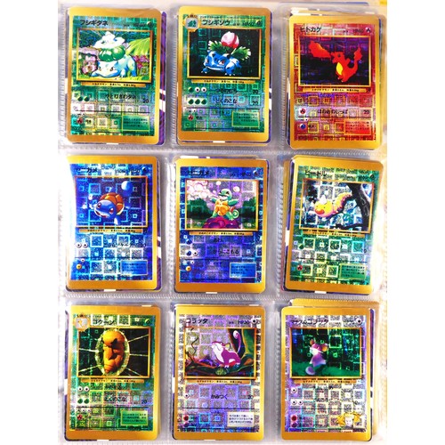 A album of approximately 400 Pokémon and Digimon mini Holographic sticker  cards, including Pokémon m