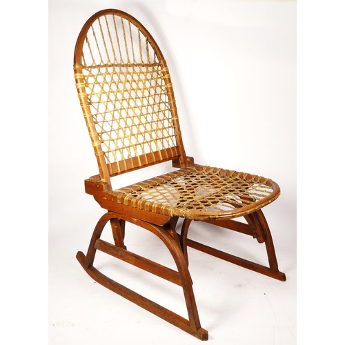 247 - A W.F. Tubbs Co SnoShu chair, folding rocking chair, with raw hide woven seat and back rest, 81cm x ... 