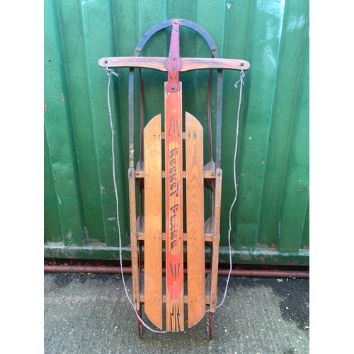 249 - A Rocket Plane sled, wooden slatted seating on painted metal frame