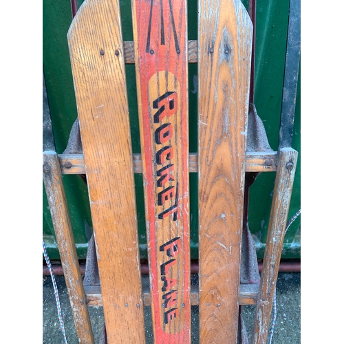 249 - A Rocket Plane sled, wooden slatted seating on painted metal frame