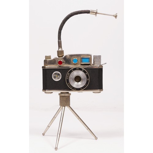 172 - A vintage novelty Photolite Japanese cigarette lighter in the form of a miniature camera complete wi... 