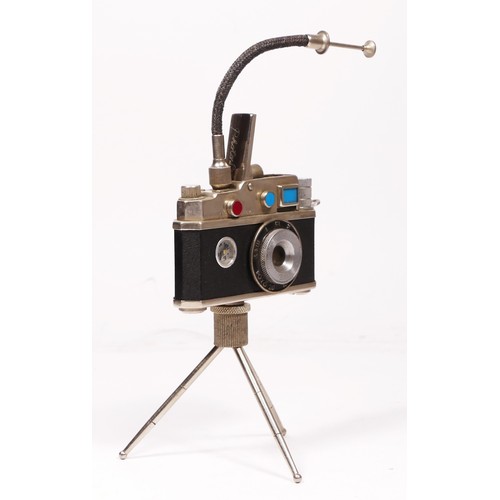 172 - A vintage novelty Photolite Japanese cigarette lighter in the form of a miniature camera complete wi... 