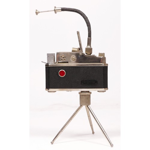 172 - A vintage novelty Photolite Japanese cigarette lighter in the form of a miniature camera complete wi... 