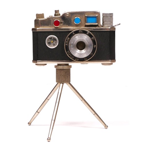 172 - A vintage novelty Photolite Japanese cigarette lighter in the form of a miniature camera complete wi... 