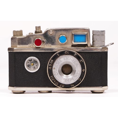 172 - A vintage novelty Photolite Japanese cigarette lighter in the form of a miniature camera complete wi... 